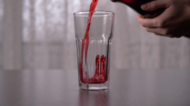 Pouring Blackcurrant Juice Tall Glass Slow Motion Straight Ahead Shot — Vídeos de Stock