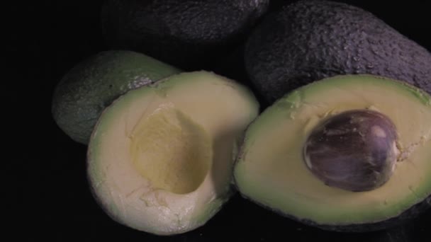 Avocadoes Black Background — Vídeos de Stock
