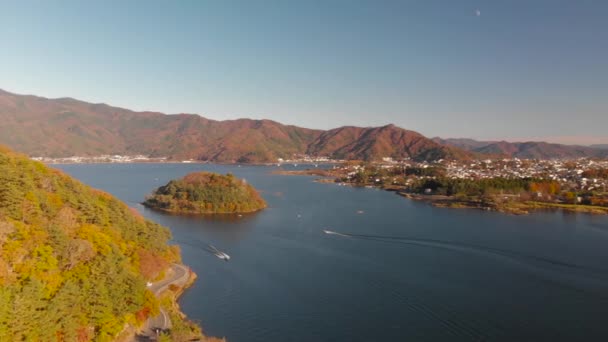 Right Rotating Aerial Drone Shot Lake Speedboats Autumn Colors — Vídeos de Stock