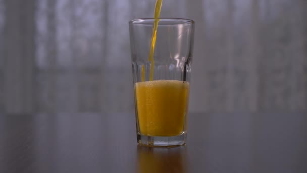 Pouring Orange Soda Tall Glass Slow Motion Straight Ahead Shot — Video Stock