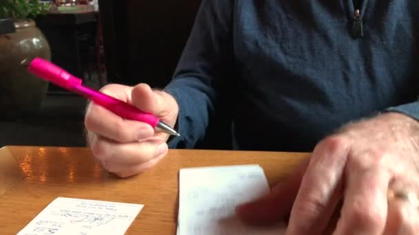 Male Hand Seen Signing Paper Receipt Table Restaurant — Vídeos de Stock