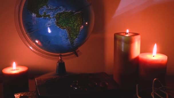 Globe Flickering Candles Light Background Wooden Surface Stones Ancient Books — Stock video