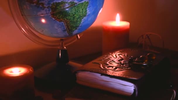 Globe Flickering Candles Light Background Wooden Surface Stones Ancient Books — Stock video