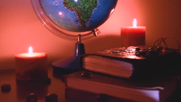 Globe Flickering Candles Light Background Wooden Surface Stones Ancient Books — Stock video