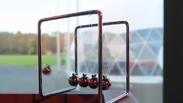 Newton Cradle Spheres Motion Colorful Background — Stockvideo