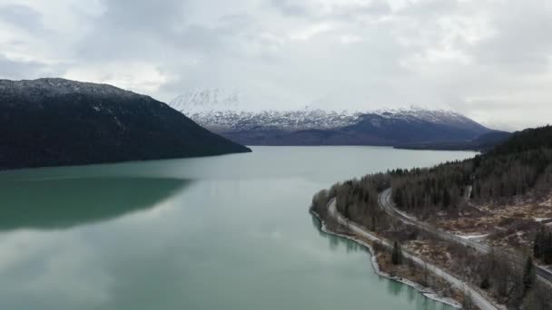 Drone Flies Next Alaskan Lake Road — стокове відео