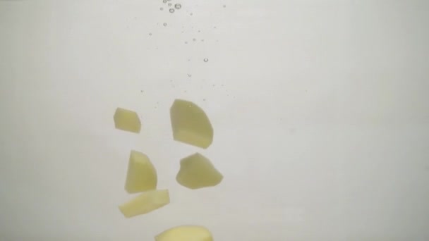 Dropping Crude Potatoes Water — Stok Video