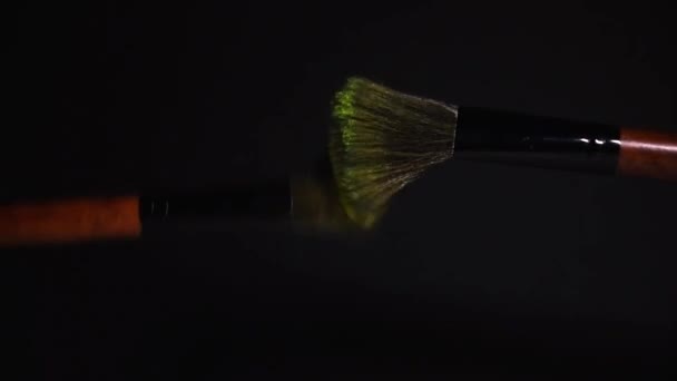 Slow Motion Two Make Brushes Yellow Powder Explosion Burst Black — Vídeos de Stock