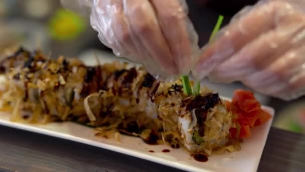 Foreground See Plate Sushi Background Chef Doing Some Preparations Put — Stock Video