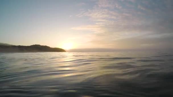 Sun Rising Ocean Water Waves Passing — Stock Video
