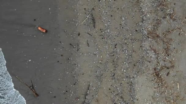 Ascending Aerial Shot Waves Washing Out Garbage Ocean Plastic Polluted — Stockvideo