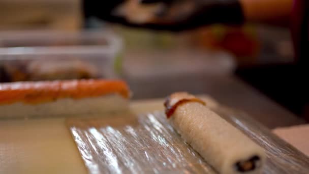 Close Scene Sushi Cooking Process Chef Hands Foreground Putting Salmon — Wideo stockowe