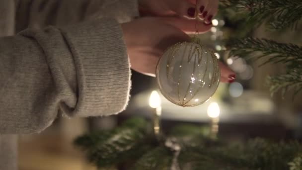 Slow Motion Woman Christmas Ball Hand Decorates Christmas Tree Night — Stockvideo