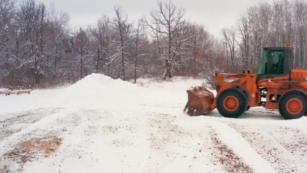 Piling Snow Front End Loader — Stockvideo