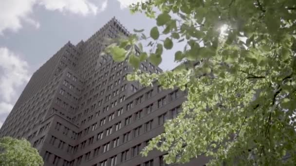 Slow Motion Modern Skyscraper Potsdamer Platz Filmed Tree Leaves — Stockvideo