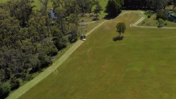 Aerial Shot Orbiting Tractor Slashing Dry Grass Rural Australia — ストック動画