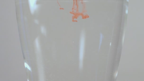 Dropping Red Watercolor Dot Glass Water — Vídeo de Stock