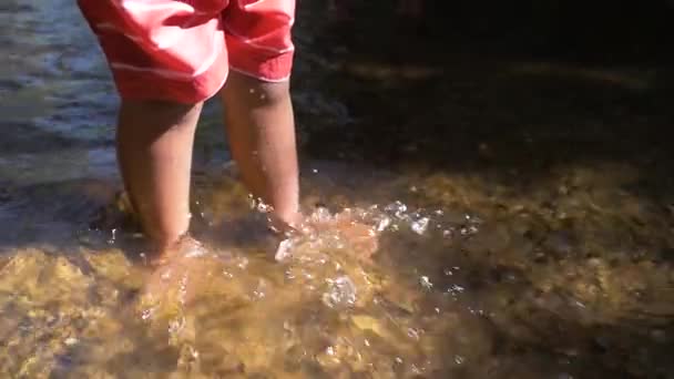 Slow Motion Shot Young Child Feet Kicking Water Stream — Vídeo de stock