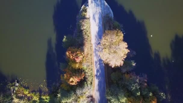 Small Lake Surrounded Trees Aerial Shot Bridge Lookdown Shot Autumn — Stockvideo