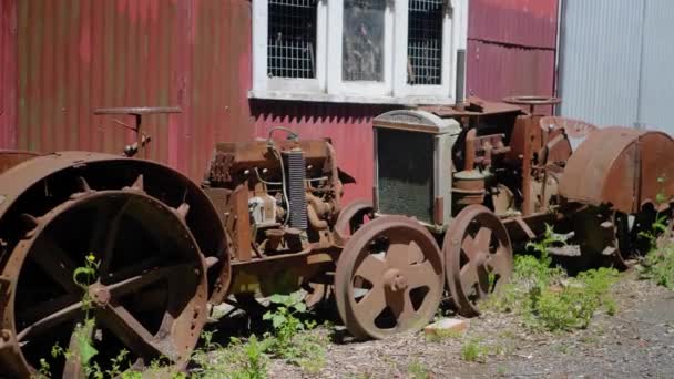 Historic Antique Tractors Out Front Old Shed — Vídeo de Stock