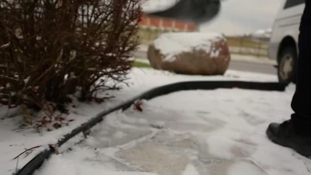 Man Shovels Fluffy Snow Walkway — Stock video