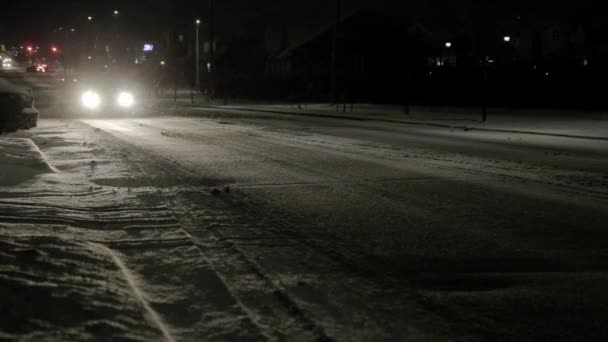 Cars Driving Main Road Suburban Area Snowstorm – stockvideo