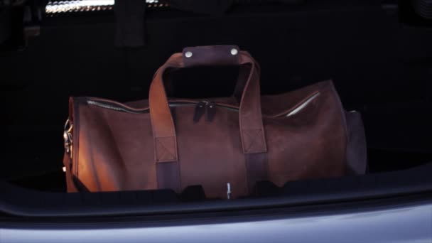 Man Takes Leather Luggage Case Car Luggage — Stockvideo