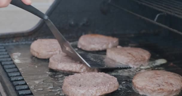 Medium Shot Hamburger Patties Grilling Barbecue Spatula Flips Burgers Lights — Stock Video
