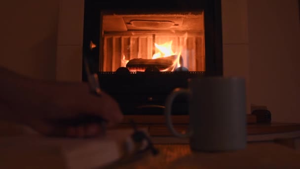 Cozy Background Young Female Hand Writing Old Notebook Warm Fireplace — Stockvideo