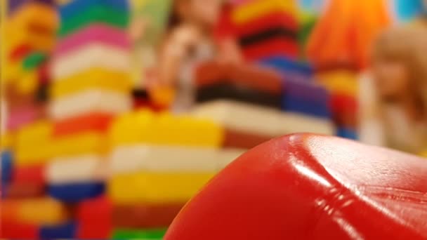 Girls Playing Colored Building Blocks Indoor Amusement Park Bokeh Background — Stockvideo