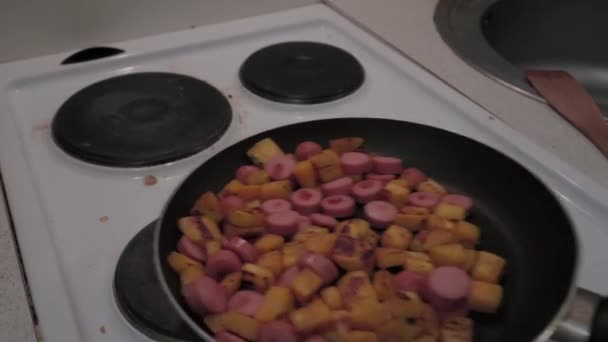 Person Cooking His Meal Making Saut Potatoes Sausages Frying Pan — Stock Video