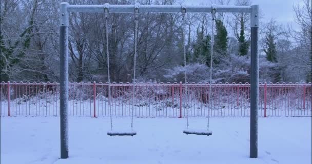 Two Swings Gently Sway Breeze Snow Countryside Play Area Shot — Vídeo de Stock