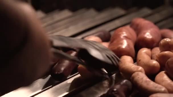 Hand Tongs Accommodate Sausages Being Fried Brick Barbecue Grill Detail — Stock videók