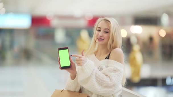 Pretty Blonde Girl Holds Her Phone Shows Screen Her Phone — Stock video