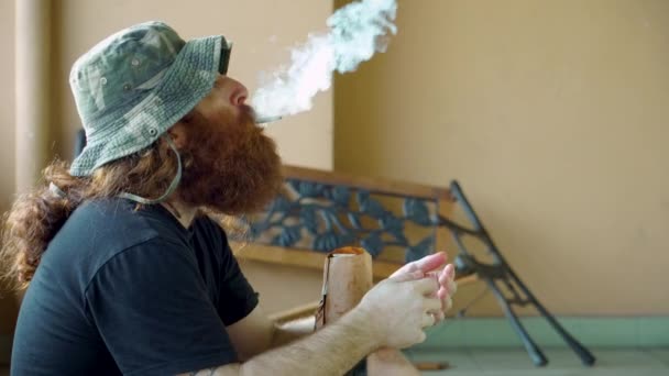 Homeless Man Lighting Marijuana Tobacco Cigarette Drinking Beer Can Outdoors — Stockvideo