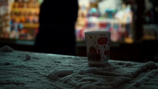 Man Takes Hot Beverage Merry Christmas Sign Table Christmas Market — Vídeo de Stock