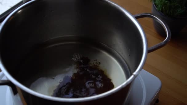 Pouring Brown Sugar Hot Water — Stockvideo