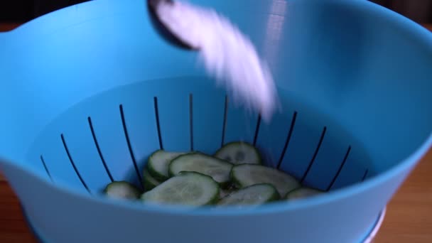 Putting Salt Cucumber Slices Tossing Them Strainer — Αρχείο Βίντεο