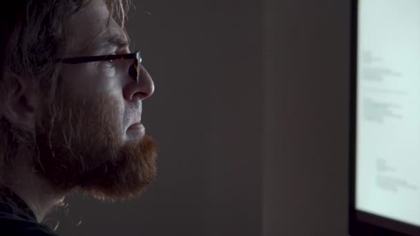 Tired Bearded Man Working Late Night Dimly Lit Office Rubs — стоковое видео