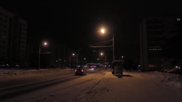 Lonely Bus Stop Night Snowy Street Lit Warm Street Lamps — Stockvideo