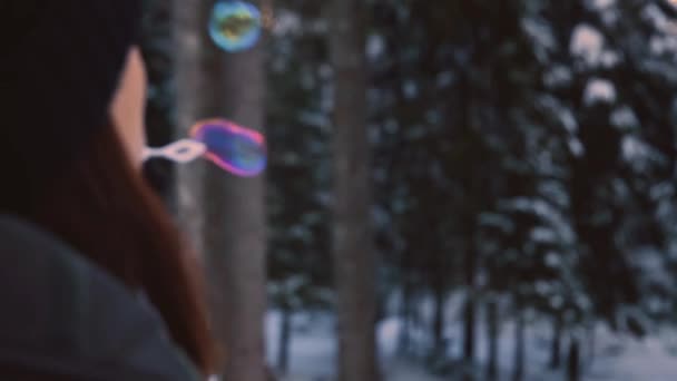 Brunette Woman Winter Clothes Blowing Rainbow Colored Soap Bubbles Flying — Αρχείο Βίντεο