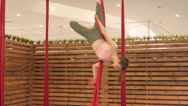 Young Brunette Woman Minimal Modern Gym Wooden Dividers Doing Flying — Video