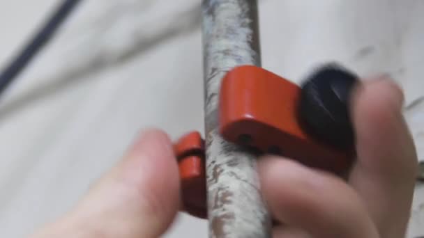 Male Hand Turns Orange Pipecutter Old Copper Pipe Repair Low — 图库视频影像