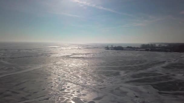 Drone Flys Forward Frozen Lake Boat Dock Distance — Stock Video