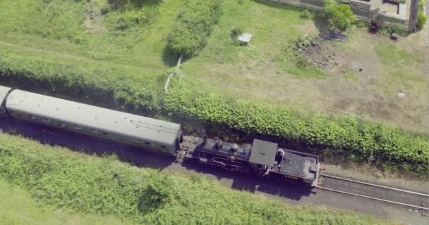 Overhead Aerial View Steam Locomotive Pulling Carriages Level Crossing Bodiam — Stock video