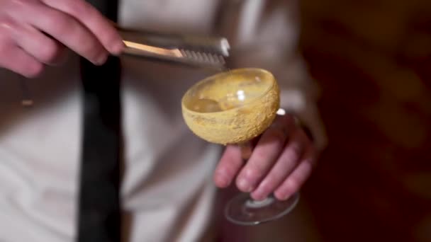 Bartender Puts Ice Cubes Cocktail Glass Tongs Close — Stock Video