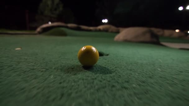 Yellow Mini Golf Ball Falls Golf Hole Bounces Pocket Course — Stock Video