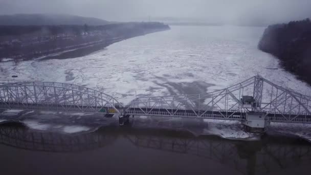 Drone Flying High Swing Bridge Big Ice Chunks Snowy River — стоковое видео