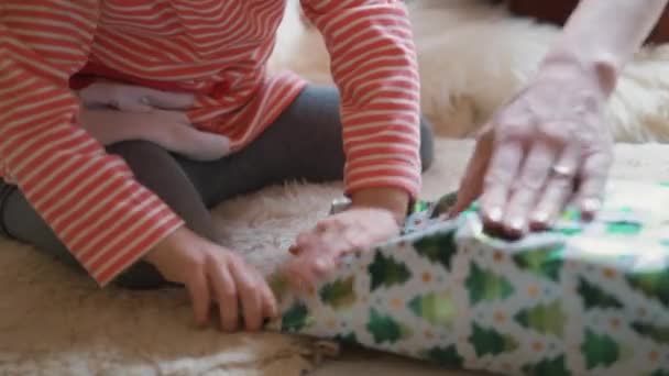 Cute Little Girl Wrapping Christmas Birthday Gift Her Mother Family — Stockvideo