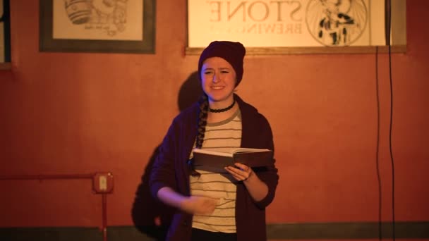 Young Women Reads Slam Poetry Book Camera Walks Stage Wearing — Vídeo de Stock